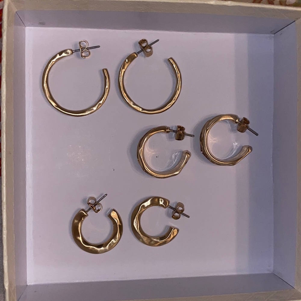 3 pairs of gold hoop earrings